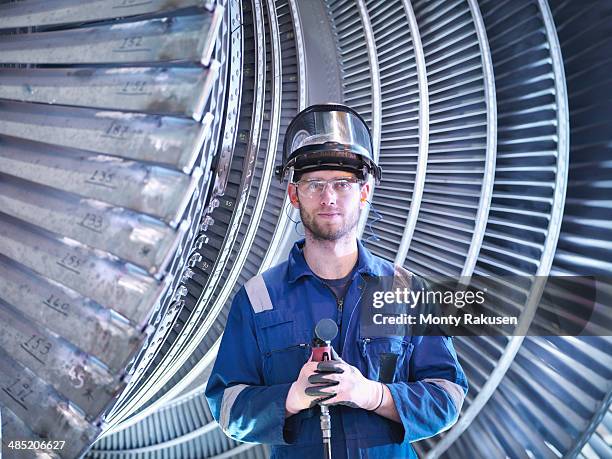 portrait of apprentice engineer in steam turbine repair workshop - porträt auszubildender stock-fotos und bilder