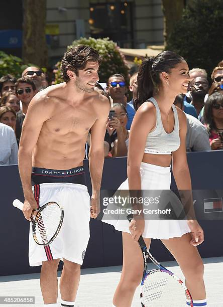 Models Akin Arkman and Chanel Iman attend the Tommy Hilfiger And Rafael Nadal Launch Global Brand Ambassadorship at Bryant Park on August 25, 2015 in...