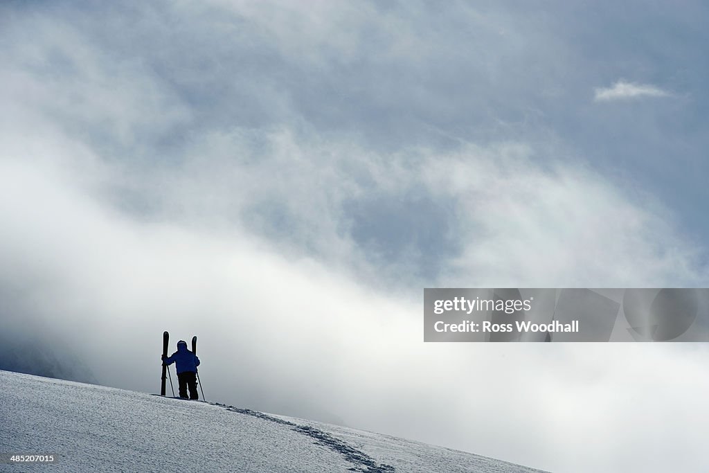 Mid adult male skier standing on hill, Obergurgl, Austria
