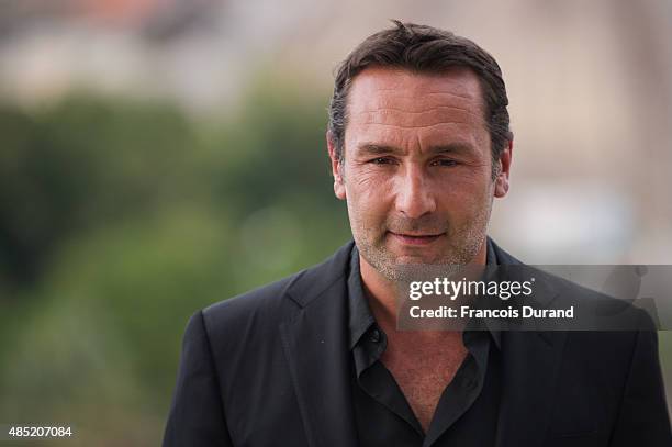 Gilles Lellouche poses during the 'Belles Familles' photocall as part of the 8th Angouleme French-Speaking Film Festival on August 25, 2015 in...