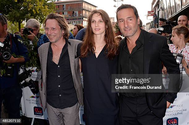 Gilles Lellouche, Marine Vacth and Mathieu Amalric pose during the 'Belles Familles' photocall as part of the 8th Angouleme French-Speaking Film...