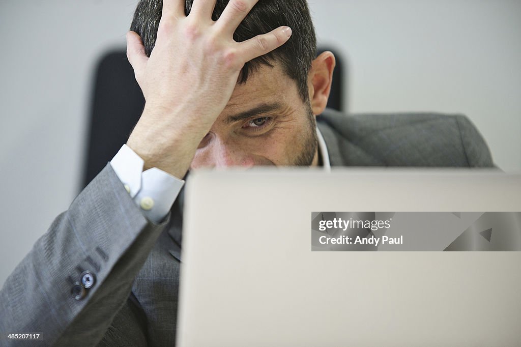 Young businessman looking stressed