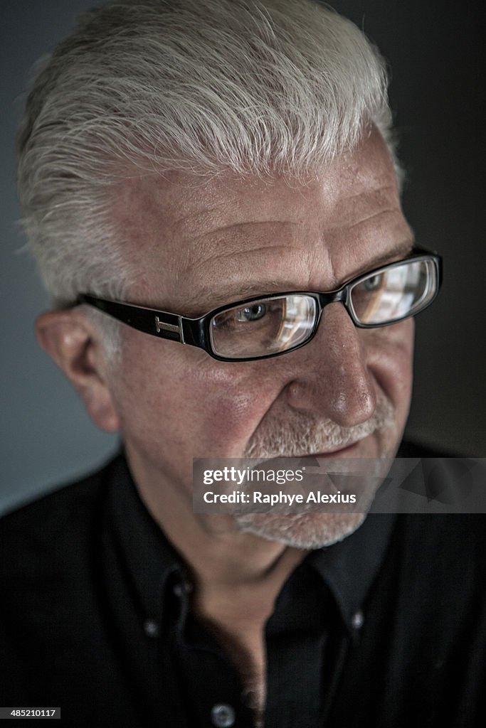 Close up of thoughtful senior man wearing spectacles