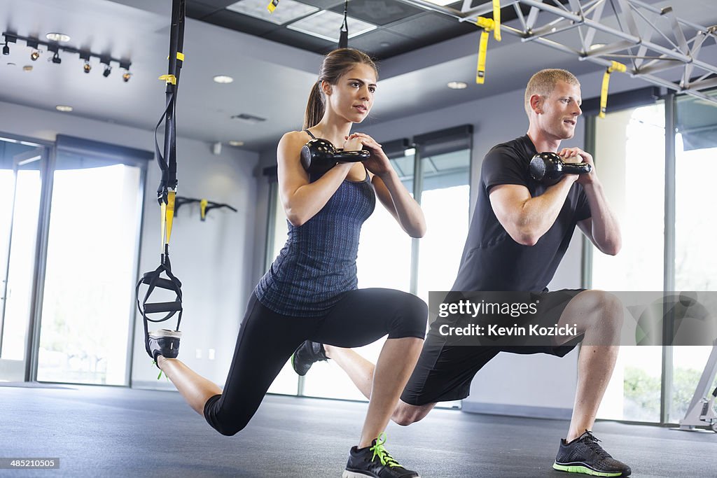 Couple working out with weights