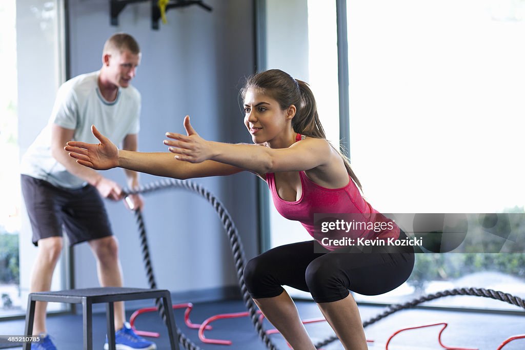 Couple working out in gym