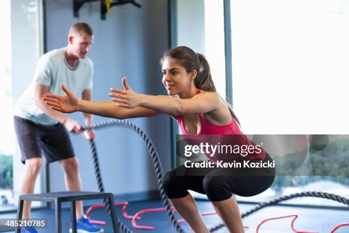 Couple working out in gym Couple working out in gym