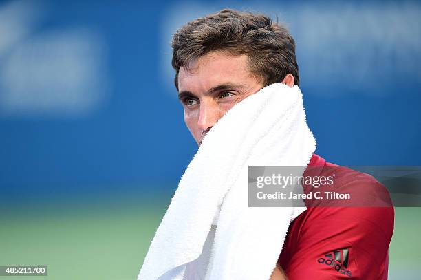 Gilles Simon of France looks on during his match against Aljaz Bedene of Great Britain during the second day of the Winston-Salem Open at Wake Forest...