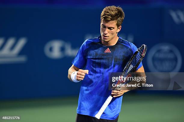 Aljaz Bedene of Great Britain reacts after a point against Gilles Simon of France during the second day of the Winston-Salem Open at Wake Forest...