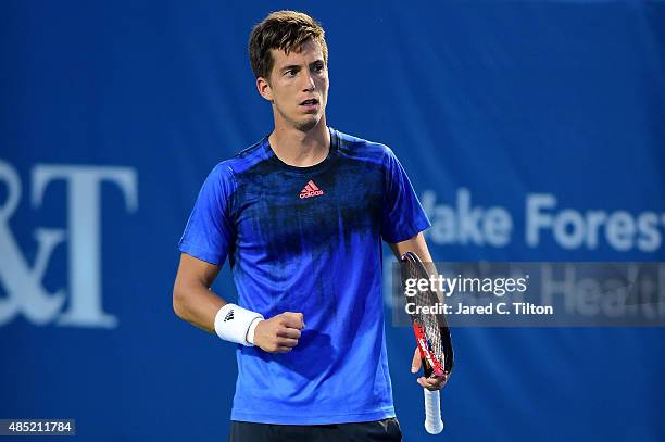 Aljaz Bedene of Great Britain reacts after a point against Gilles Simon of France during the second day of the Winston-Salem Open at Wake Forest...