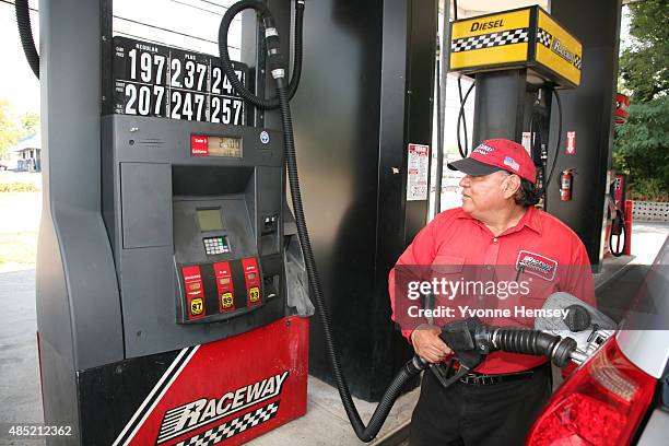 An attendant at a Raceway Petroleum station pumps gas on August 25, 2015 in Woodbridge, New Jersey. Some places in New Jersey are seeing prices under...