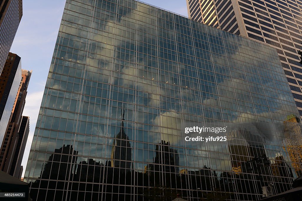 USA, New York State, New York City, Reflection of Empire State Building and skyline in building facade