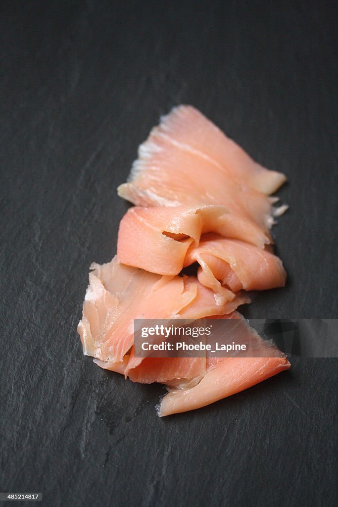Smoked salmon on slate board