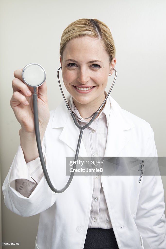 Female doctor holding a stethoscope