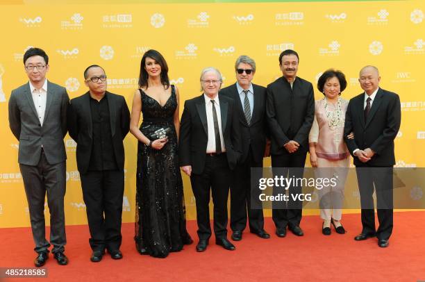 Jury members Lu Chuan, Ning Hao, Maria Grazia Cucinotta, Philippe Muyl, Andres Vicente Gomez, Rajkumar Hirani and John Woo arrive for the red carpet...