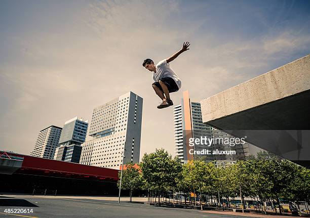 parkour in the city - man jump outdoor young city stock pictures, royalty-free photos & images