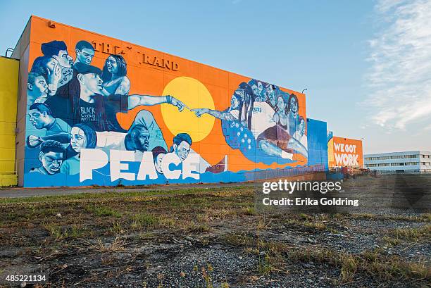 Brandan "BMike" Odums' Wall of Peace mural nears completion on The Grand Theater, vacant since Hurricane Katrina, on August 25, 2015 in New Orleans,...