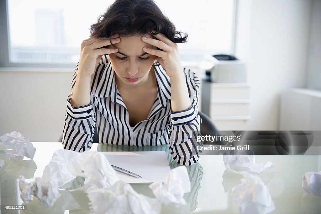 Overworked businesswoman sitting at desk