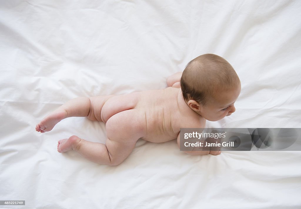 Baby girl (2-5 months) crawling