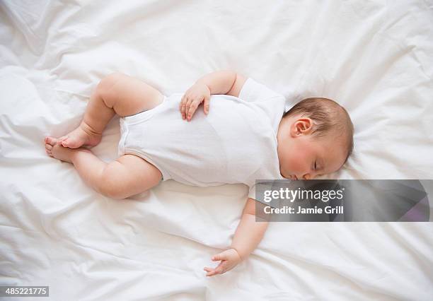 baby girl (2-5 months) sleeping in bed - baby sleep stock pictures, royalty-free photos & images