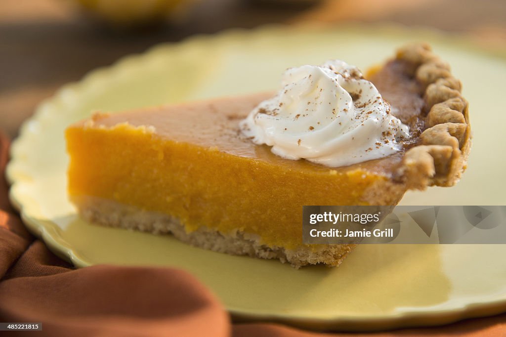 Slice of homemade pumping pie on plate
