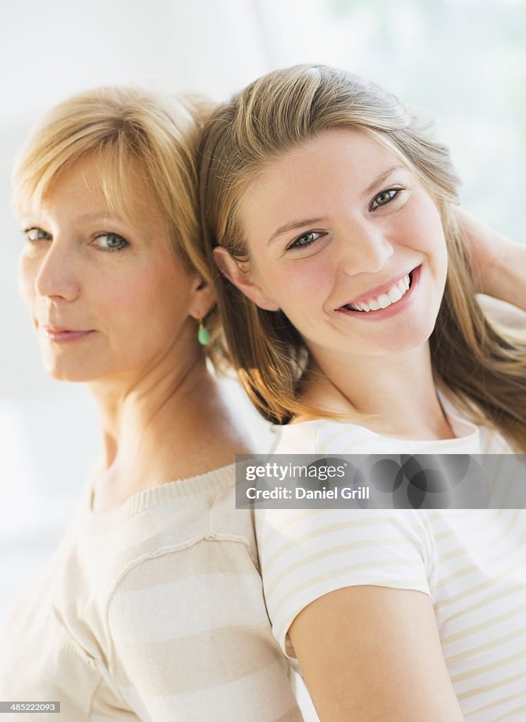 Portrait of mother and adult daughter