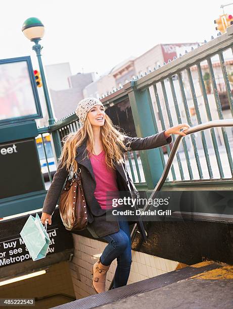 usa, new york city, brooklyn, williamsburg, portrait of blond woman leaving subway station - williamsburg new york city bildbanksfoton och bilder