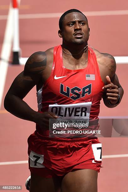 S David Oliver competes in a heat of the men's 110 metres hurdles athletics event at the 2015 IAAF World Championships at the "Bird's Nest" National...