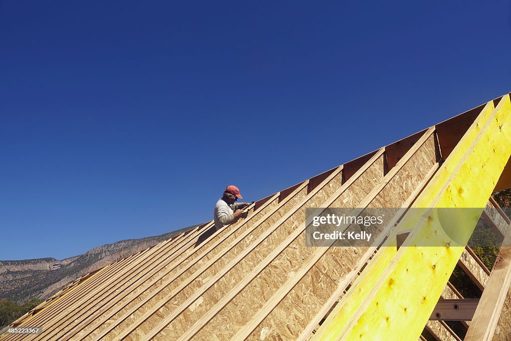 USA, Colorado, Construction worker working on construction site