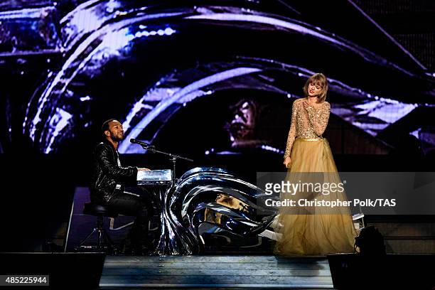 Singer-songwriters John Legend and Taylor Swift perform onstage during Taylor Swift The 1989 World Tour Live In Los Angeles at Staples Center on...