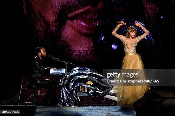 Singer-songwriters John Legend and Taylor Swift perform onstage during Taylor Swift The 1989 World Tour Live In Los Angeles at Staples Center on...