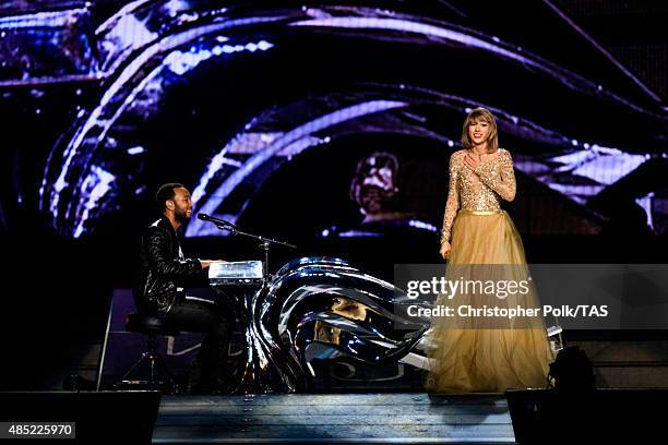 Singer-songwriters John Legend and Taylor Swift perform onstage during Taylor Swift The 1989 World Tour Live In Los Angeles at Staples Center on...