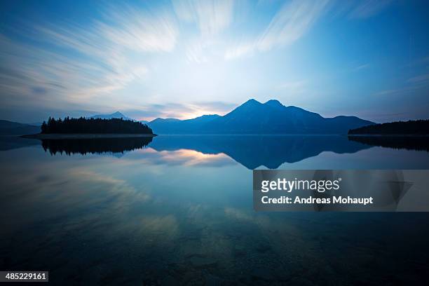sunset on lake walchensee in germany, bavaria - mecklenburger seenplatte stock-fotos und bilder