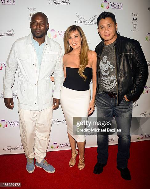 Jimmy Jean-Louis, Cindy Cowan, and Cung Le attend Linda's Voice hosts BBQ and Bikinis benefit at Mr. C Beverly Hills on August 25, 2015 in Beverly...