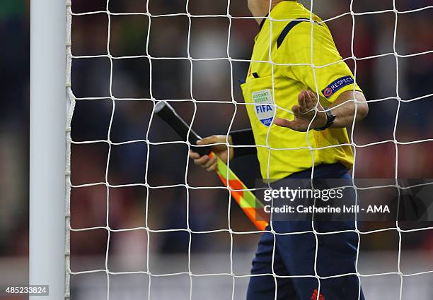 The assistant referee checks the goal net before the UEFA Europa League Play Off Round 1st Leg match between Southampton and FC Midtjylland at St...