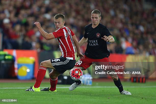 James Ward-Prowse of Southampton and Andre Romer of FC Midtjylland during the UEFA Europa League Play Off Round 1st Leg match between Southampton and...