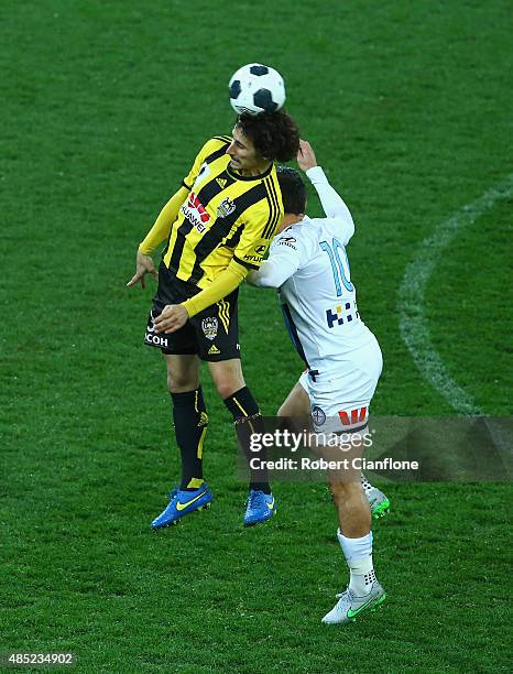Albert Riera of the Phoenix heads the ball ahead of Robert Koren of Melbourne City during the FFA Cup Round of 16 match between Melbourne City FC and...