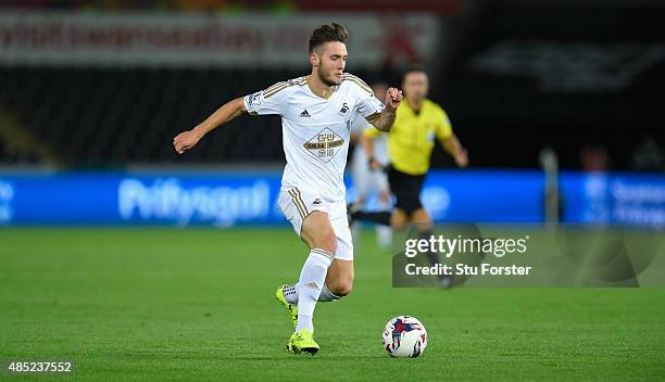 Swansea player Matt Grimes in action during the Capital One Cup Second Round match between Swansea City and York City at Liberty Stadium on August...