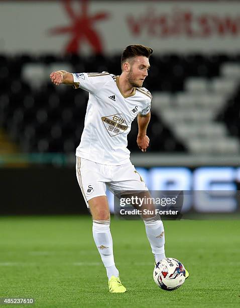Swansea player Matt Grimes in action during the Capital One Cup Second Round match between Swansea City and York City at Liberty Stadium on August...