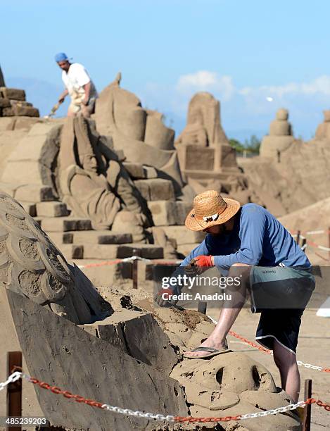 Sand sculptor carves his work at Lara Beach on April 17, 2014 in Antalya, Turkey. 25 sculptors from 12 countries work on the sculptures for the 8th...