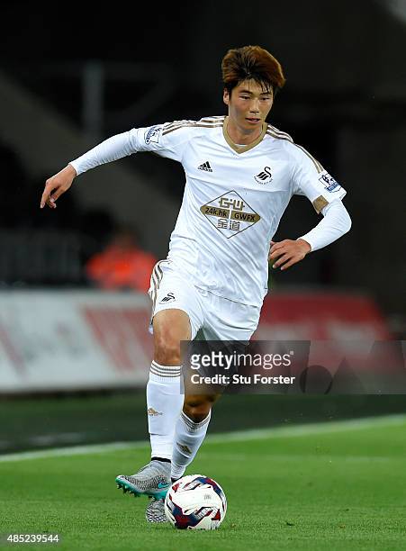 Swansea player Ki Sung Yueng in action during the Capital One Cup Second Round match between Swansea City and York City at Liberty Stadium on August...