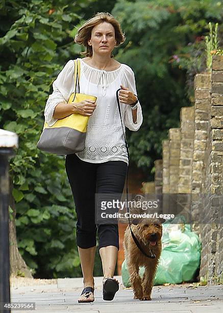 Presenter Fiona Bruce takes her dog for a walk on August 20, 2015 in London, England.