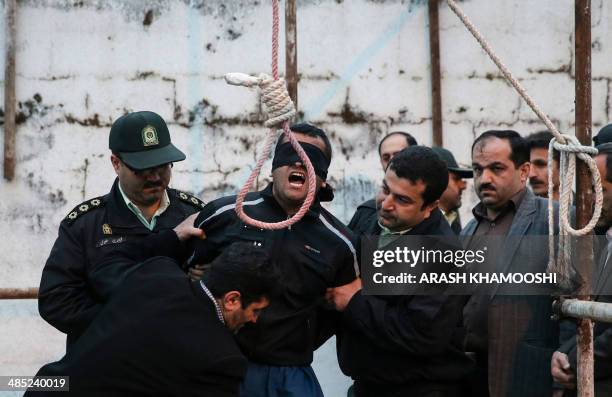 Balal, who killed Iranian youth Abdolah Hosseinzadeh in a street fight with a knife in 2007, is brought to the gallows during his execution ceremony...