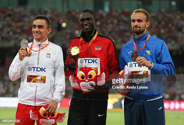 Silver medalist Adam Kszczot of Poland, gold medalist David Lekuta Rudisha of Kenya and bronze medalist Amel Tuka of Bosnia and Herzegovina pose on...