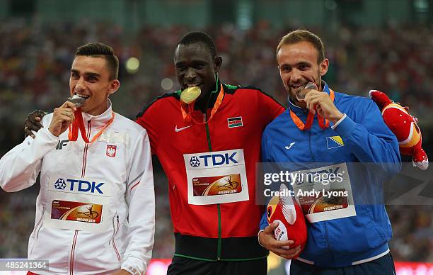 Silver medalist Adam Kszczot of Poland, gold medalist David Lekuta Rudisha of Kenya and bronze medalist Amel Tuka of Bosnia and Herzegovina pose on...