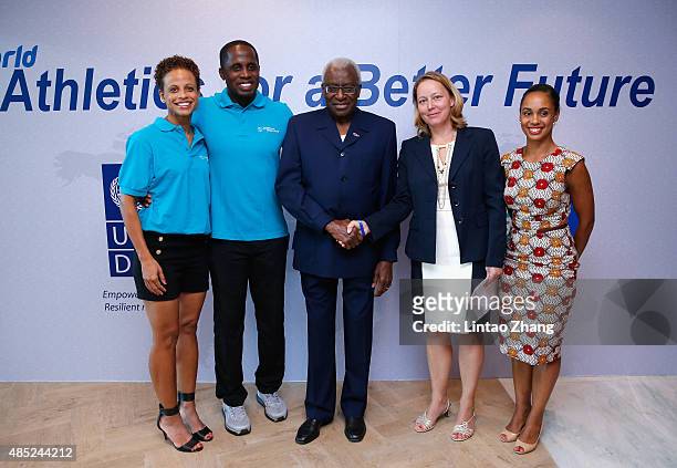 Olympic champions Joanna Hayes and Dwight Phillips, IAAF President Lamine Diack and Agi Veres pose for a photograph after the IAAF Athletics Better...