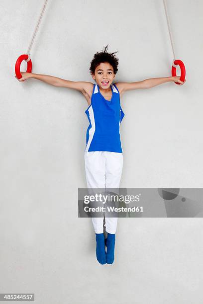 boy exercising iron cross on rings - gymnastic rings equipment bildbanksfoton och bilder