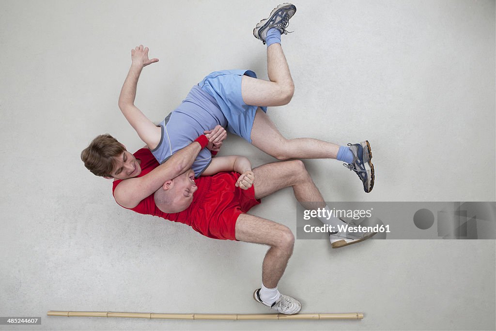 Two men wrestling