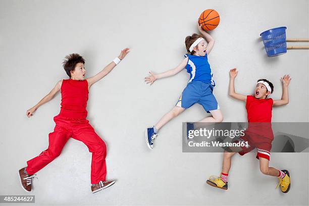 boys playing basket ball - boys basketball stock pictures, royalty-free photos & images