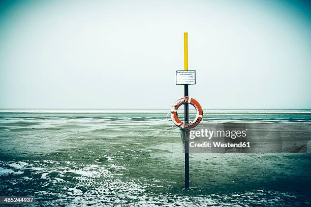 germany, lower saxony, lifesaver at the beach of langeoog - wadden sea stock pictures, royalty-free photos & images