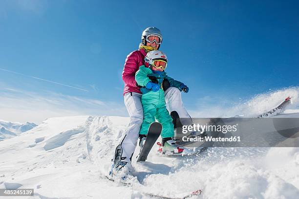 austria, salzburg country, altenmarkt-zauchensee, family skiing in mountains - schifahren stock-fotos und bilder